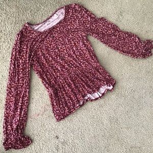 This is a long sleeve shirt with flowers all over